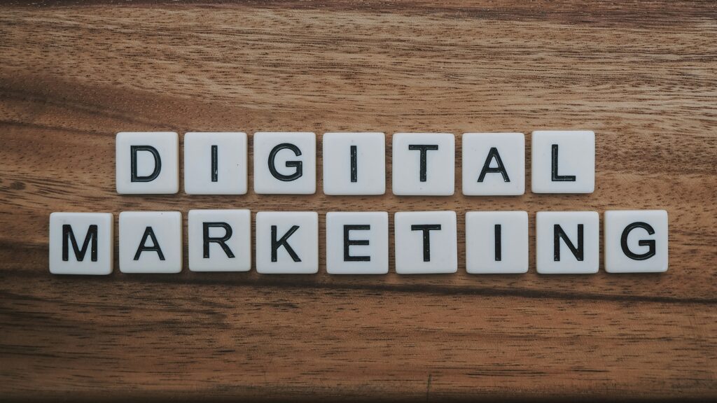 Creative workstation with smartphone, notebook, and digital marketing ideas