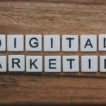 Creative workstation with smartphone, notebook, and digital marketing ideas