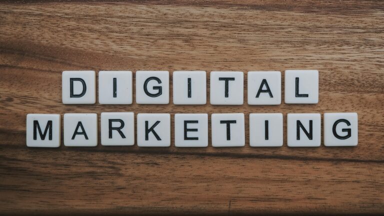 Creative workstation with smartphone, notebook, and digital marketing ideas